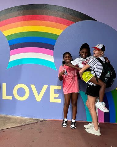 <p>Charlize Theron/Instagram</p> Charlize Theron with her two daughters at Disney World.