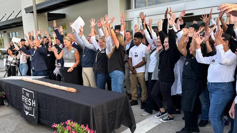 The staff of The Fresh Market at Lakewood Ranch raised their hands in welcome Wednesday morning, 4/24/2024. The grocery is located in The Green shopping center, 11525 S.R. 70 E. , Lakewood Ranch