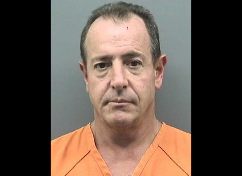 In this mug shot released by the 2011 Hillsborough County Jail, Michael Lohan, 51, poses for his mugshot after being arrested for battery domestic violence on October 25, 2011 in Hillsborough County, Tampa, Florida. Lohan, was also previously arrested in 2009 in New York for allegedly violating a protection order against him.  (Getty)