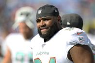 Miami Dolphins defensive tackle Christian Wilkins stands on the sideline before an NFL football game against the Buffalo Bills, Sunday, Oct. 20, 2019, in Orchard Park, N.Y. Wilkins was penalized and ejected after a play early in the game. (AP Photo/Ron Schwane)