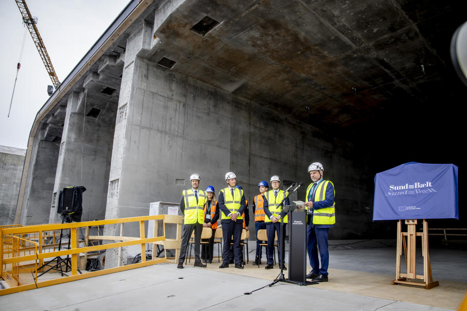 Denmark's King Frederik X, left, visits the Fehmarn Belt tunnel construction site at Roedbyhavn and inaugurates the first tunnel element, on the island of Lolland, Denmark, Monday June 17, 2024. Danish King Frederik X inaugurated Monday the first element of a future 18-kilometer (11-mile) rail-and-road tunnel under the Baltic Sea that will link southern Denmark to northern Germany and contribute to the transport sector's green transition. (Ingrid Riis/Ritzau Scanpix via AP)