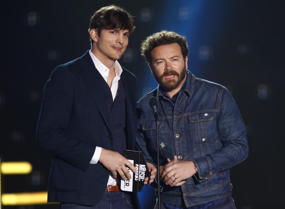 FILE- Ashton Kutcher, left, and Danny Masterson present the award for collaborative video of the year at the CMT Music Awards at Music City Center on June 7, 2017, in Nashville, Tenn. Ashton Kutcher and Mila Kunis are apologizing for character letters the celebrity couple wrote on behalf of Masterson ahead of this week's sentencing of their fellow "That '70s Show" cast member. A judge in Los Angeles on Thursday, Sept. 7, 2023, sentenced Masterson to 30 years to life in prison for raping two women in 2003. (Photo by Wade Payne/Invision/AP, File)