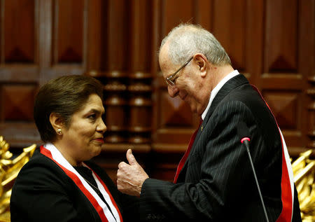Peru's President Pedro Pablo Kuczynski (R) gestures after receiving the presidential sash from President of Congress Luz Salgado during his inauguration ceremony in Lima, Peru, July 28, 2016. REUTERS/Mariana Bazo
