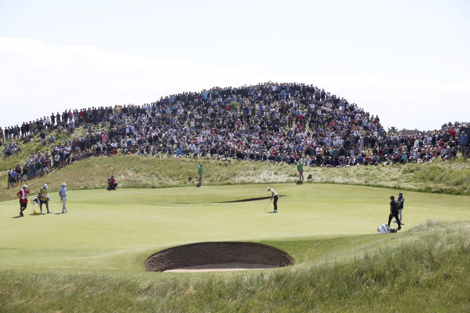 Northern Ireland's Rory McIlroy puts on the 6th green during the second round of the British Open Golf Championship at Royal St George's golf course Sandwich, England, Friday, July 16, 2021. (AP Photo/Ian Walton)