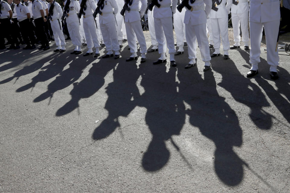 Soldiers wait for French President Emmanuel Macron during a ceremony marking the 75th anniversary of the WWII Allied landings in Provence, in Saint-Raphael, southern France, Thursday, Aug. 15, 2019. Starting on Aug. 15, 1944, French and American troops — 350,000 in total — landed on the French Riviera. U.S. forces drove north while French troops — many from French colonies in Africa — moved along the coast to secure key ports. (Eric Gaillard/POOL via AP)