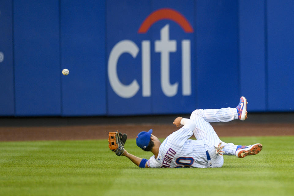 New York Mets right fielder Michael Conforto (30) cannot make a catch on a hit by Pittsburgh Pirates Josh Bell during the second inning of a baseball game, Friday, July 26, 2019, in New York. (AP Photo/Corey Sipkin)