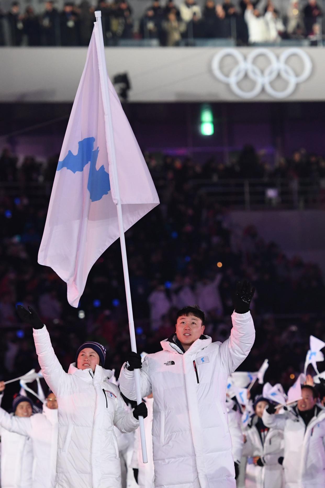 Unified Korea's flag bearers lead the delegation parade during the opening ceremony of the 2018 Winter Olympic Games&nbsp;on February 9, 2018. (Photo: KIRILL KUDRYAVTSEV via Getty Images)