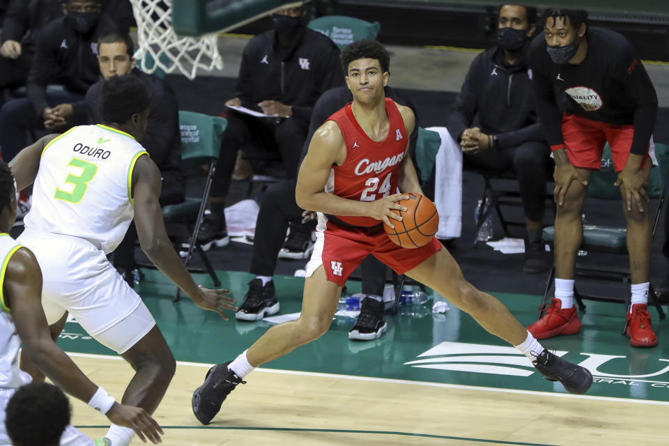 Houston's Quentin Grimes steps out to shoot against South Florida's Prince Oduro during the second half of an NCAA college basketball game Wednesday, Feb. 10, 2021, in Tampa, Fla. Houston won 82-65. (AP Photo/Mike Carlson)