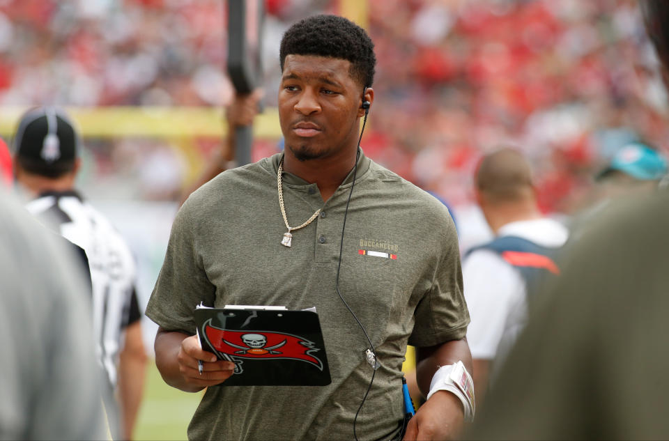 Quarterback Jameis Winston #3 of the Tampa Bay Buccaneers looks over his clipboard on the sidelines during an NFL football game against the New York Jets in Tampa, on Nov. 12, 2017.