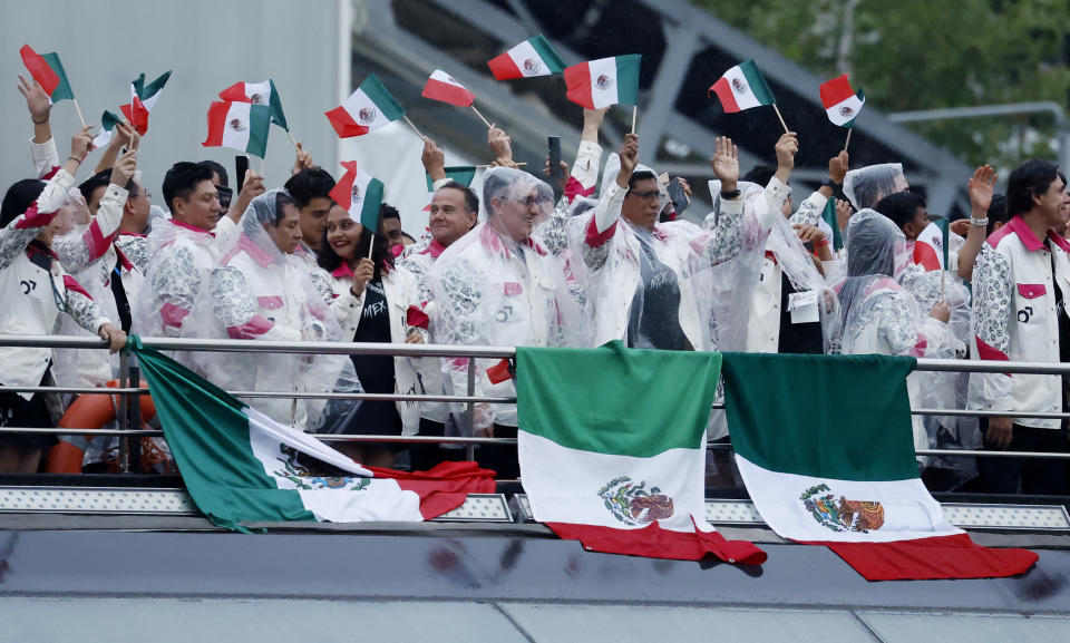 PARIS, FRANCE - JULY 26: Athletes in the delegation of Mexico aboard a boat in the floating parade on the river Seine during the Opening Ceremony of the Olympic Games Paris 2024 on July 26, 2024, in Paris, France. (Photo by Clodagh Kilcoyne - Pool/Getty Images)