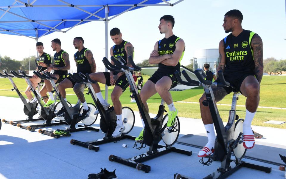 Arsenal players on exercise bikes during their mid-season training in Dubai