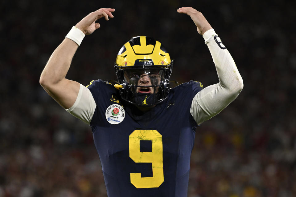 Michigan quarterback J.J. McCarthy (9) reacts after running back Blake Corum scored a touchdown during overtime at the Rose Bowl CFP NCAA semifinal college football game against Alabama Monday, Jan. 1, 2024, in Pasadena, Calif. (AP Photo/Kyusung Gong)