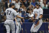 New York Yankees' Aaron Judge, right, celebrates with Giancarlo Stanton after scoring against the Tampa Bay Rays during the seventh inning of a baseball game Sunday, Sept. 4, 2022, in St. Petersburg, Fla. (AP Photo/Scott Audette)