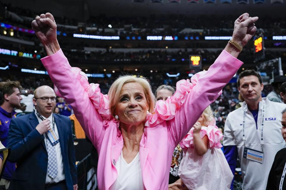 LSU head coach Kim Mulkey celebrates after an NCAA Women's Final Four semifinals basketball game against Virginia Tech Friday, March 31, 2023, in Dallas. LSU won 79-72 to advance to the championship game on Sunday. (AP Photo/Darron Cummings)