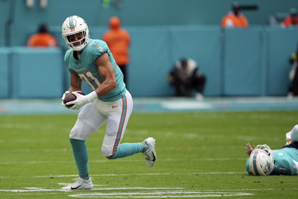 FILE - Miami Dolphins quarterback Tua Tagovailoa (1) gets tackled by Green Bay Packers linebacker Kingsley Enagbare (55) after passing the ball to Dolphins tight end Durham Smythe (81), during the first half of an NFL football game, Sunday, Dec. 25, 2022, in Miami Gardens, Fla. Tagovailoa has officially been ruled out for Sunday's game at New England after suffering a concussion in Miami's Christmas Day loss to Green Bay. (AP Photo/Jim Rassol, File)