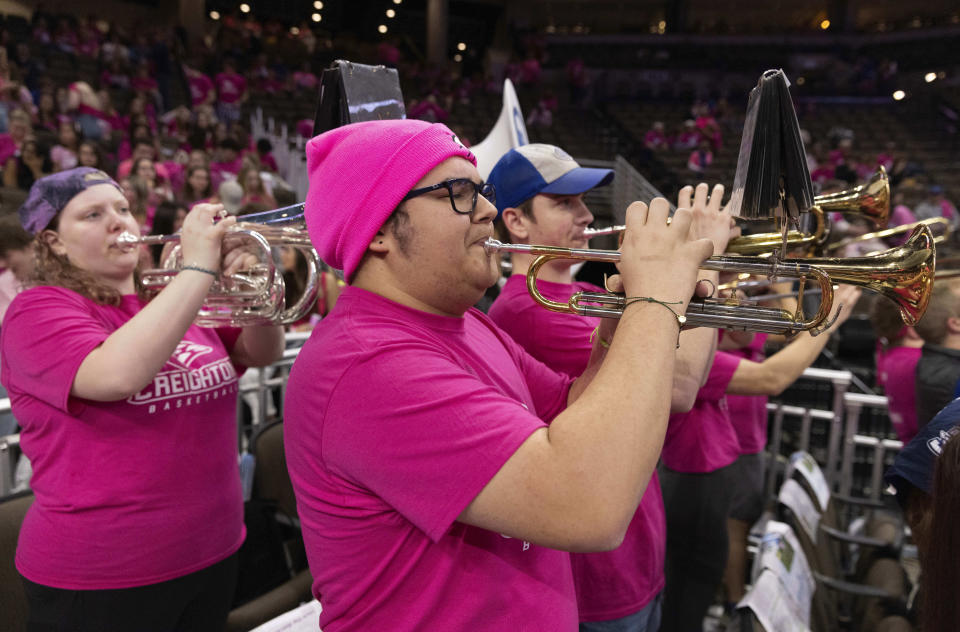 Creighton junior Kevin Diver, front, of Chicago plays trumpet with the pep band before DePaul played against Creighton in an NCAA college basketball game Saturday, Jan. 27, 2024, in Omaha, Neb. (AP Photo/Rebecca S. Gratz)