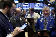 Traders work on the floor of the New York Stock Exchange December 15, 2015. REUTERS/Brendan McDermid