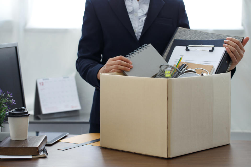 Woman packing up her desk