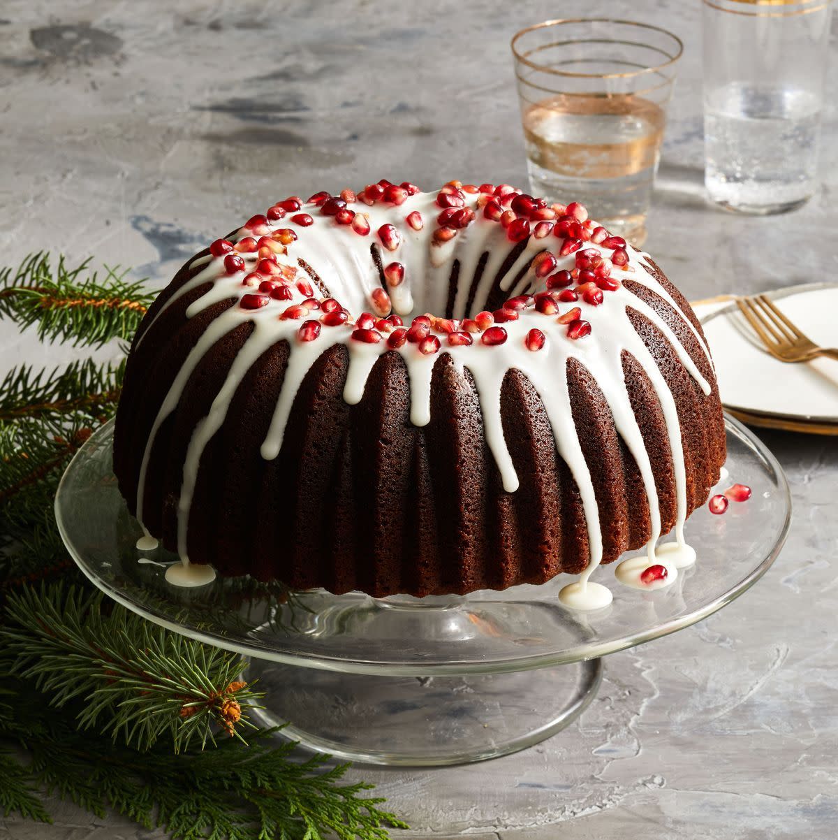 gingerbread bundt cake on a clear cake stand