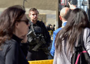 <p>A Toronto police officer stands guard at the police line after a van mounted a sidewalk crashing into pedestrians in Toronto on Monday, April 23, 2018. (Photo: Frank Gunn/The Canadian Press via AP) </p>
