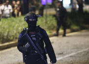 Officers stand guard at the site where an explosion that police said came from a firecracker, near the venue of the presidential candidates debate in Jakarta, Indonesia, Sunday, Feb. 17, 2019. Indonesia is gearing up to hold its presidential election on April 17 that will pit in the incumbent against the former general.(AP Photo / Achmad Ibrahim)