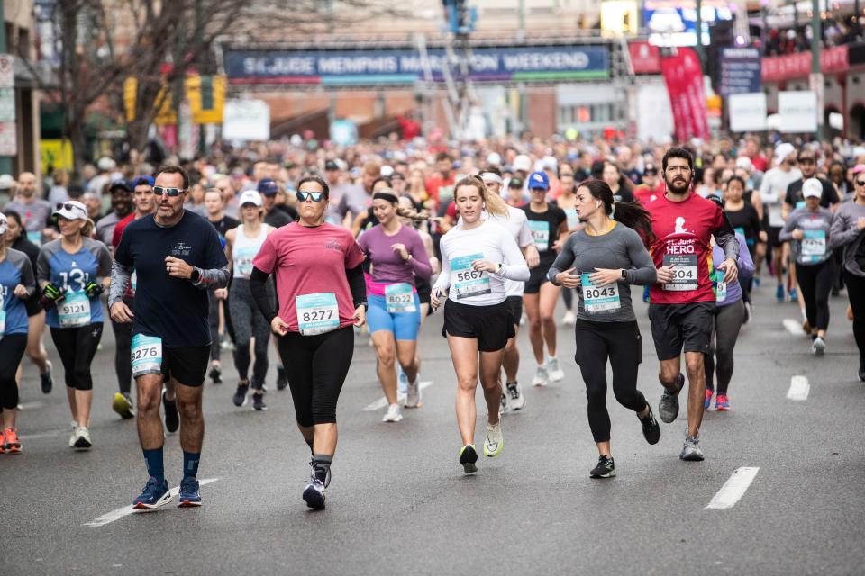 Runners participate in St. Jude’s annual 5K marathon starting near Beale St on Dec. 3, 2022 in Memphis, TN.