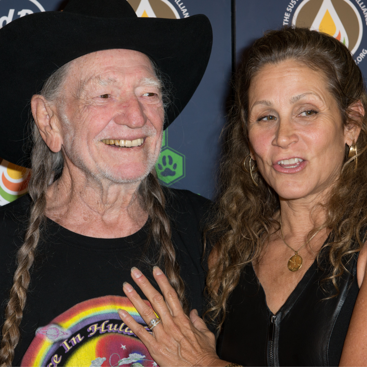  Willie Nelson and Annie D'Angelo attend Hard Rock International's Wille Nelson Artist Spotlight Benefit Concer at Hard Rock Cafe, Times Square on June 6, 2013 in New York City. 
