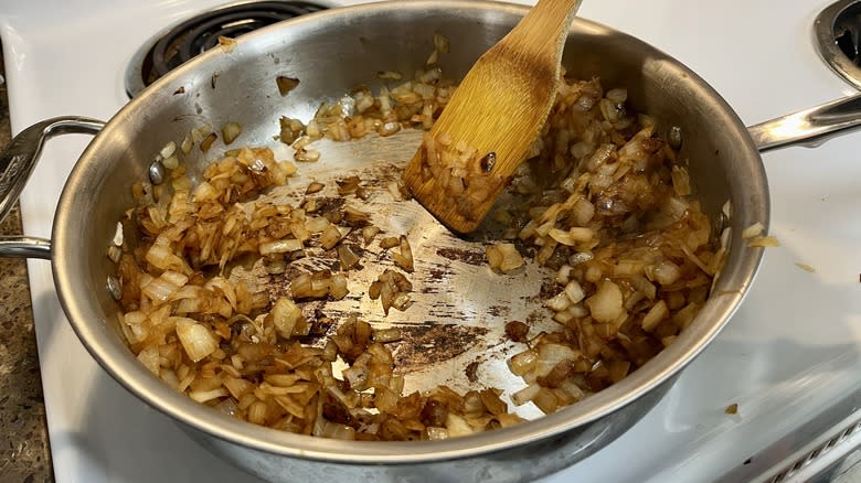 onions in pan with spatula