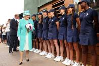 <p>Queen Elizabeth II visits with the ball boys and girls.</p>