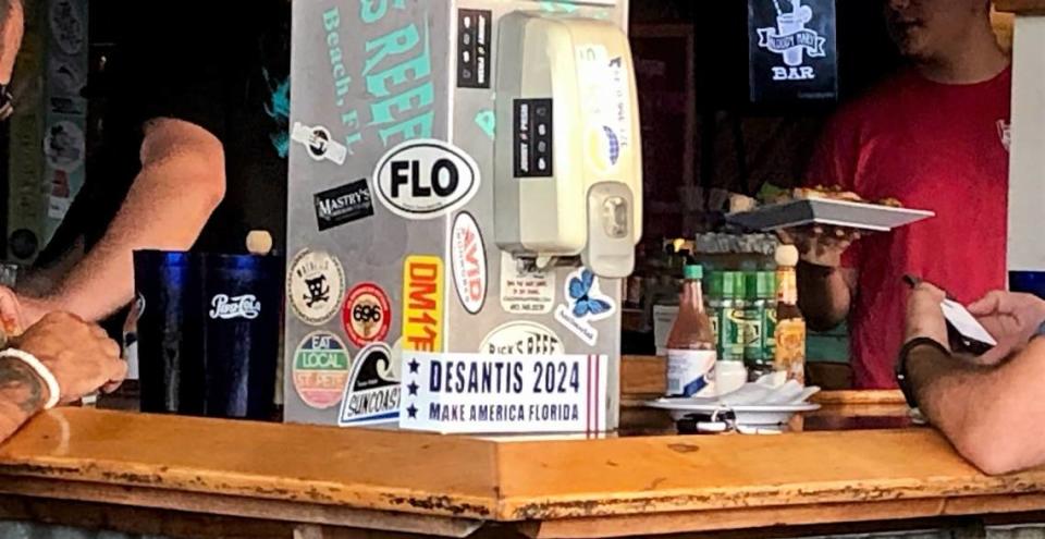 At Rick’s Reef in St. Pete Beach, Florida, your summer vacation dining view includes the bumper sticker “DeSantis 2024 Make America Florida” promoting the governor’s possible run for the US presidency. 