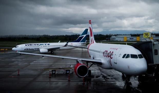 The COVID-19 pandemic has ground an unprecedented number of flights in Canada and around the world. (Darryl Dyck/The Canadian Press - image credit)