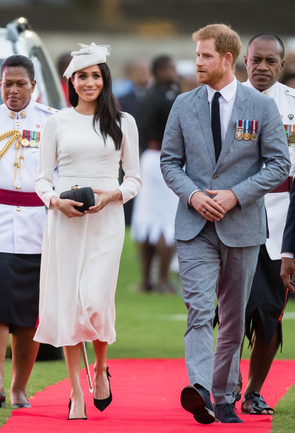 The Duke and Duchess of Sussex were pictured earlier in the day arriving in Fiji. Meghan was wearing a white Zimmermann dress. Photo: Getty Images