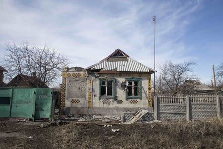 A house damaged by fighting is seen in the town of Debaltseve February 25, 2015. REUTERS/Baz Ratner