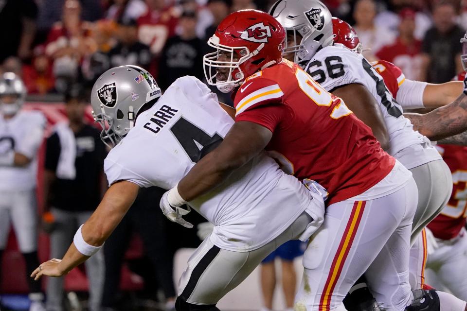 Derek Carr is sacked by Kansas City Chiefs defensive tackle Chris Jones on Oct. 10, 2022. Jones was called for a penalty on the play for roughing the passer.