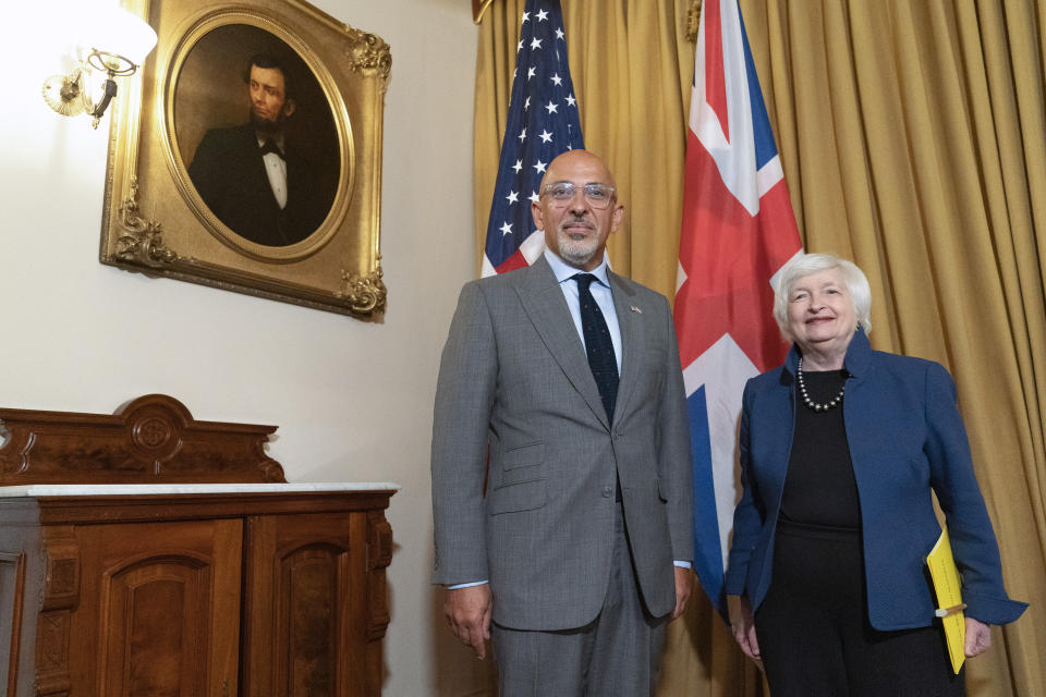 Treasury Secretary Janet Yellen, right, stands with the United Kingdom's Chancellor of the Exchequer Nadhim Zahawi at the Treasury Department, Wednesday, Aug. 31, 2022, in Washington. (AP Photo/Jacquelyn Martin)
