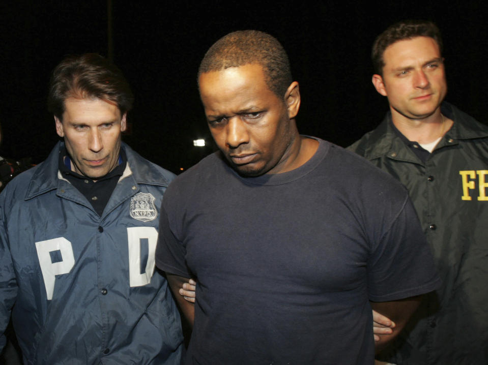 FILE - James Cromitie, center, is led by police officers from a federal building in New York after being arrested on charges related to a bombing plot in The Bronx, Thursday, May 21, 2009. Four men snared in an infamous post-9/11 terrorism sting were ordered freed from prison Thursday, July 27, 2023, with a judge finding that they had been "hapless, easily manipulated and penurious petty criminals" caught up in a plot driven by an overzealous FBI and a dodgy informant. (AP Photo/Robert Mecea, File)