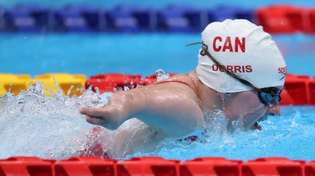 Danielle Dorris of Canada races to gold in the women's S7 50-metre butterfly final at the Tokyo Aquatics Centre.  (Kim Kyung-Hoon/Reuters - image credit)