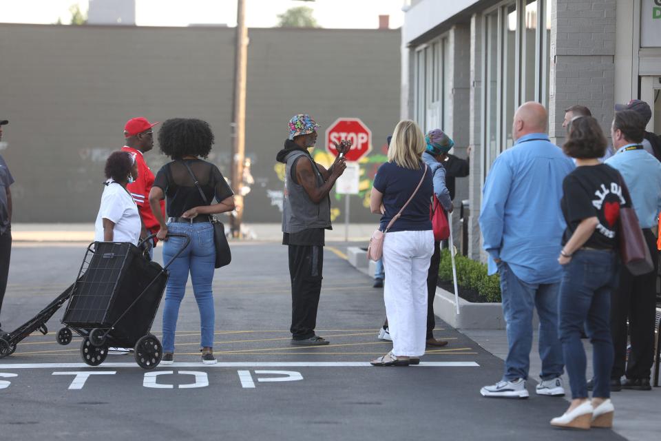 A few local residents are the first customers to head in to Tops Friendly Market on Jefferson Ave, in Buffalo, NY on Friday, July 15, 2022.  The store opened two months after 10 people were killed and three injured in a mass shooting that targeted Black people.