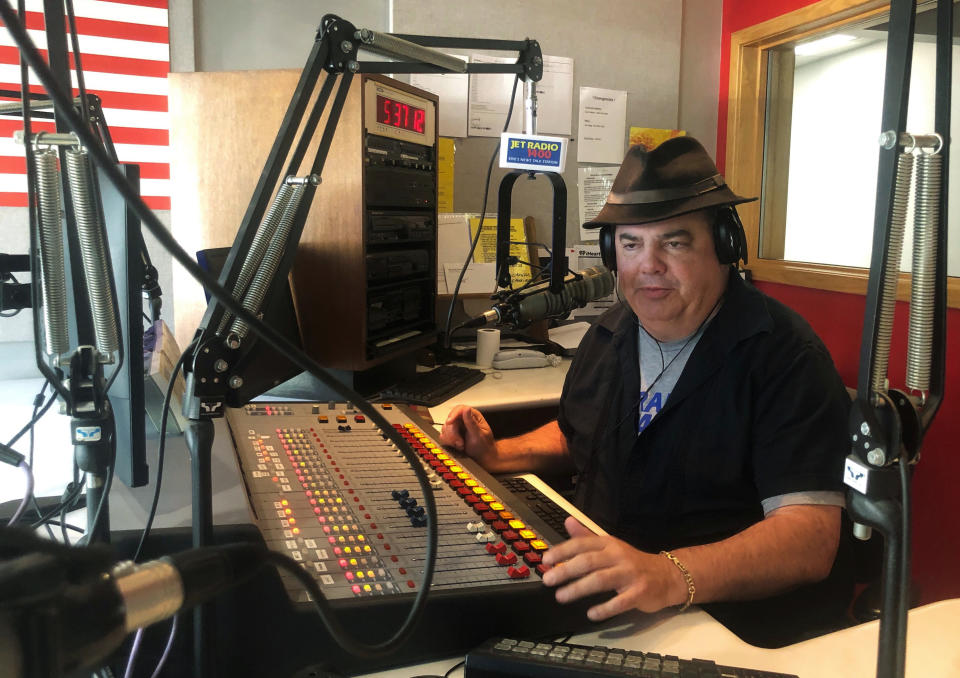 In this Friday, Aug. 2, 2019, photo, Scott Bremner, talk radio host, works in Erie, Pa. Months ago, Bremner had tried to establish if his listeners could agree on a fundamental question: what is racism? The answer, he realized, is no, we don't even agree on that. (AP Photo/Claire Galofaro)