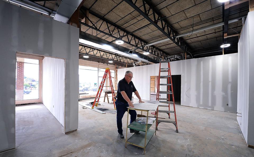 Kevin Simmers, founder of Brooke's House, looks over blueprints for a substance abuse recovery center that is under construction at the South End Shopping Center on Maryland Avenue. The 4,150 square-foot facility will provide walk-in assessments for those suffering from addiction.