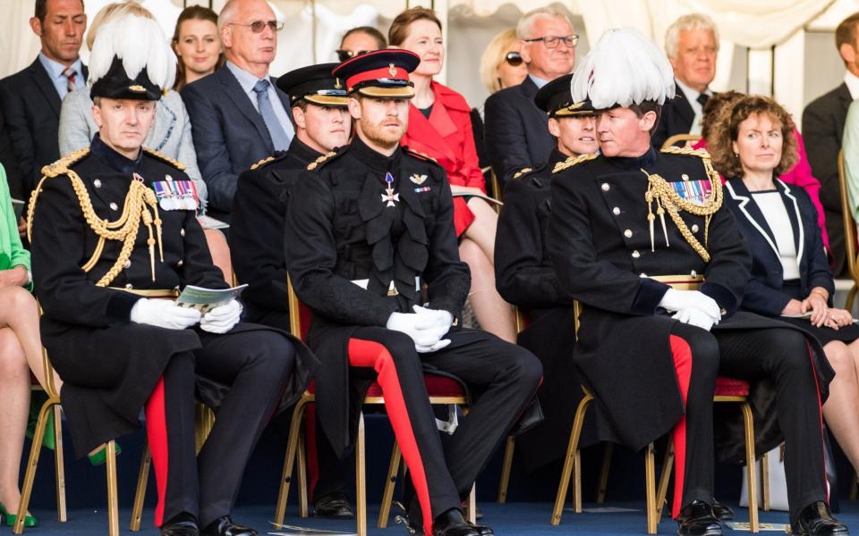 Prince Harry (C) with senior officers as the Massed Bands of the Household Division - Credit: MoD