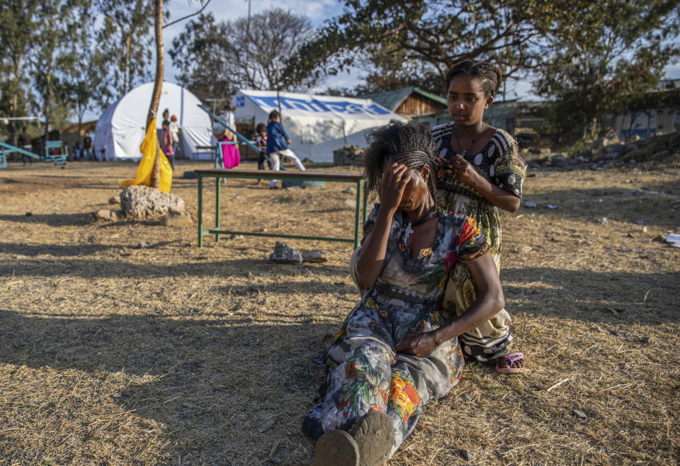 Almaz, 12, braids the hair of Zinabu at a center for people displaced by the recent conflict located in Meseret Primary School in Mekele, the capital of the Tigray region of northern Ethiopia Monday, Feb. 22, 2021. (Zerihun Sewunet/UNICEF via AP)