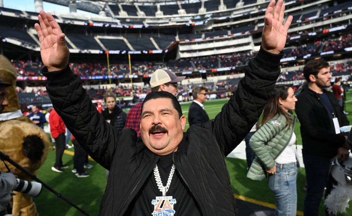 Guillermo Rodriguez lifts his arms to the fans recognizing people he knows at the Jimmy Kimmel LA Bowl against Washington State Saturday, Dec. 17, 2022 in Inglewood, CA.