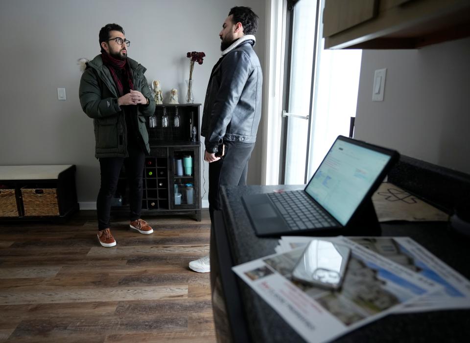 Sinan Falah, an Iraq refugee and real estate agent, shows a Worthington condominium on Sunday, Jan. 14, 2024, to buyer Mohamad Mizyan. Falah was among Coldwell Banker Realty's top agents in central Ohio last year, and most of his clients are former refugees and immigrants.