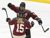 Montreal's Laura Stacey (7) celebrates her tying goal against Minnesota with Maureen Murphy (15) during the third period of a PWHL hockey game Thursday, April 18, 2024, in Montreal. (Christinne Muschi/The Canadian Press via AP)