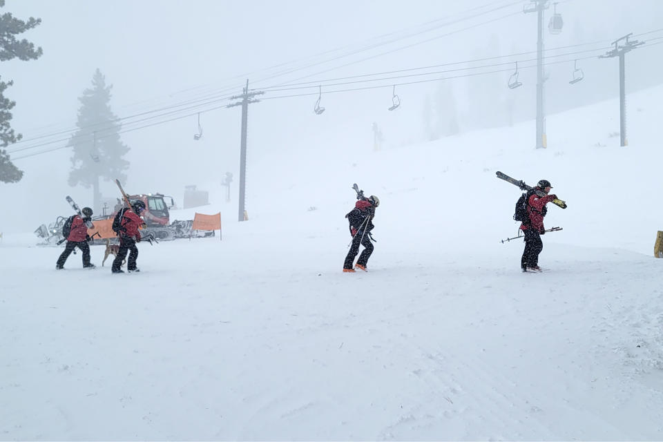 Rescues crews work at the scene of an avalanche at the Palisades Tahoe ski resort on Wednesday, Jan. 10, 2024, near Lake Tahoe, Calif. The avalanche roared through a section of expert trails at the ski resort as a major storm with snow and gusty winds moved into the region, authorities said. (Mark Sponsler via AP)