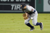 RETRANSMISSION TO CORRECT NAME FROM JACK MAYFIELD TO JOSE ROJAS - Houston Astros second baseman Jose Altuve bobbles a ball hit by Los Angeles Angels' Jose Rojas during the sixth inning of a baseball game Thursday, Sept. 23, 2021, in Anaheim, Calif. Rojas was safe at first on the play and Altuve was charged with an error. (AP Photo/Mark J. Terrill)