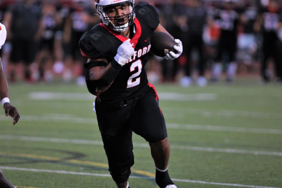 Milford senior Tofa Luani scores his first rushing TD of the game during a football game with Anderson playing at Milford Sept. 8, 2023 at Milford High School.