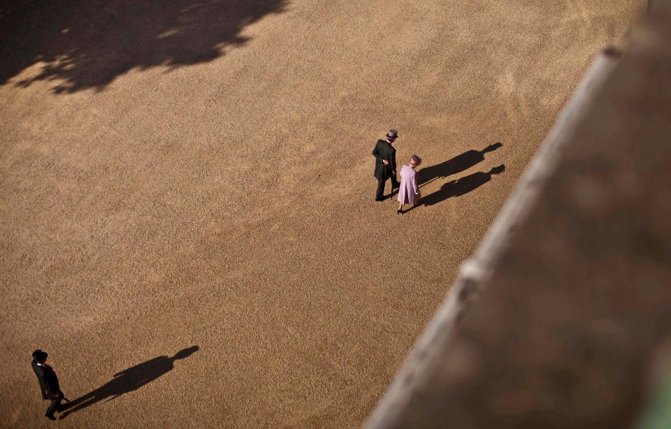 Queen Elizabeth II and Prince Phillip, Duke of Edinburgh, walk back to the Palace after attending a royal garden party held in the grounds of Buckingham Palace in London, on June 29, 2011.<span class="copyright">Matt Dunham—WPA Pool/Getty Images</span>