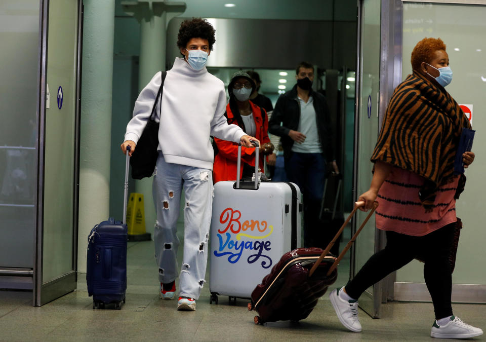 Passengers arrive from Paris at the Eurostar train terminal at St. Pancras station in London, as Britain imposes a 14-day quarantine on arrival from France from Saturday amid the coronavirus pandemic, in London, Britain, August 14, 2020. / Credit: PETER NICHOLLS/REUTERS